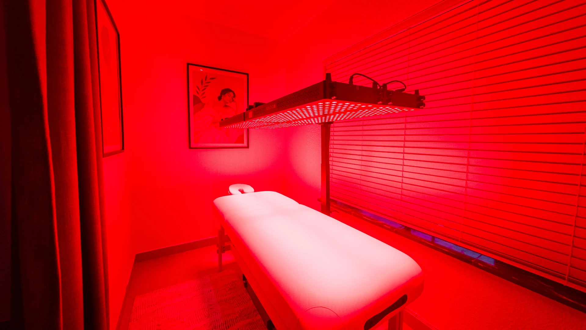 Red light near-infrared session room glowing with therapeutic light